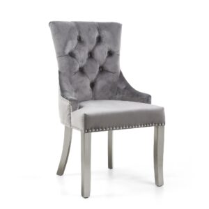 Elegant gray velvet chair with high button-tufted back, smooth seat, and silver nailhead trim. Tone is sophisticated and modern.