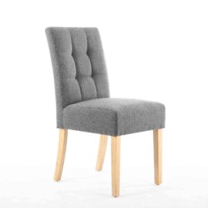 A gray, tufted fabric chair with a cushioned seat, featuring light wooden legs. The design is modern and elegant, conveying a sense of comfort and style.