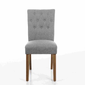 A grey upholstered dining chair with a high, button-tufted backrest and light wooden legs, set against a plain white background. The tone is elegant and simple.