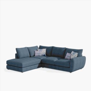 Blue L-shaped sectional sofa with three back cushions and two patterned throw pillows. The sofa is set against a plain white background.
