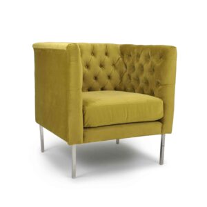 A vintage-style, mustard-yellow armchair with tufted velvet upholstery and silver metal legs, exudes comfort and elegance in a modern design.