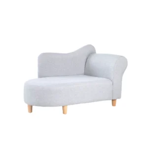 Elegant light gray chaise lounge on short wooden legs, featuring a modern, curved backrest and armrest on one side. The tone is minimalist and stylish.