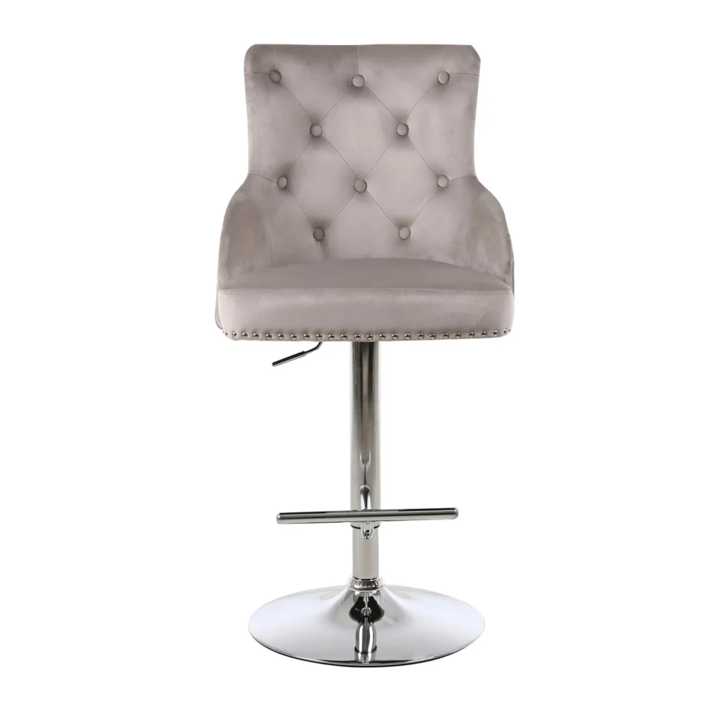 Elegant swivel bar stool with grey velvet upholstery, button-tufted backrest, and chrome pedestal base with footrest, exuding a modern and sophisticated feel.
