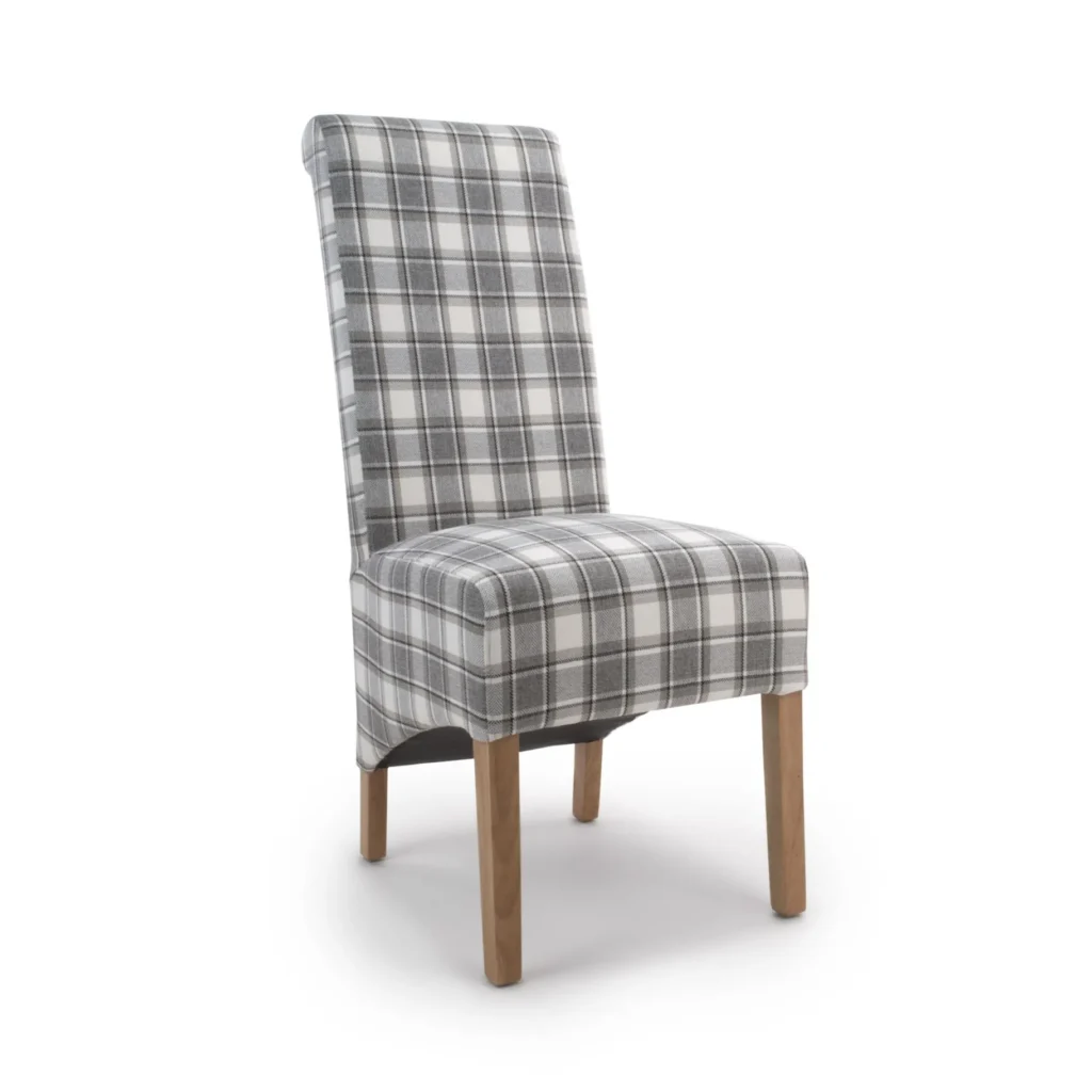 A plaid-patterned chair with a high back and cushioned seat. The fabric is gray and white, covering light wooden legs, creating a cozy and classic look.