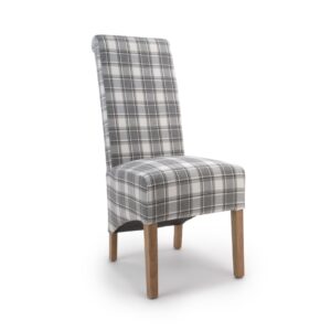A chair with a tall backrest, upholstered in gray and white plaid fabric, features light wooden legs. The style is modern and minimalist.